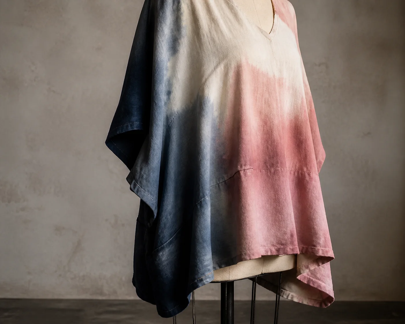 Loose hand-dyed cotton garment on a dress form with visible seams and hem