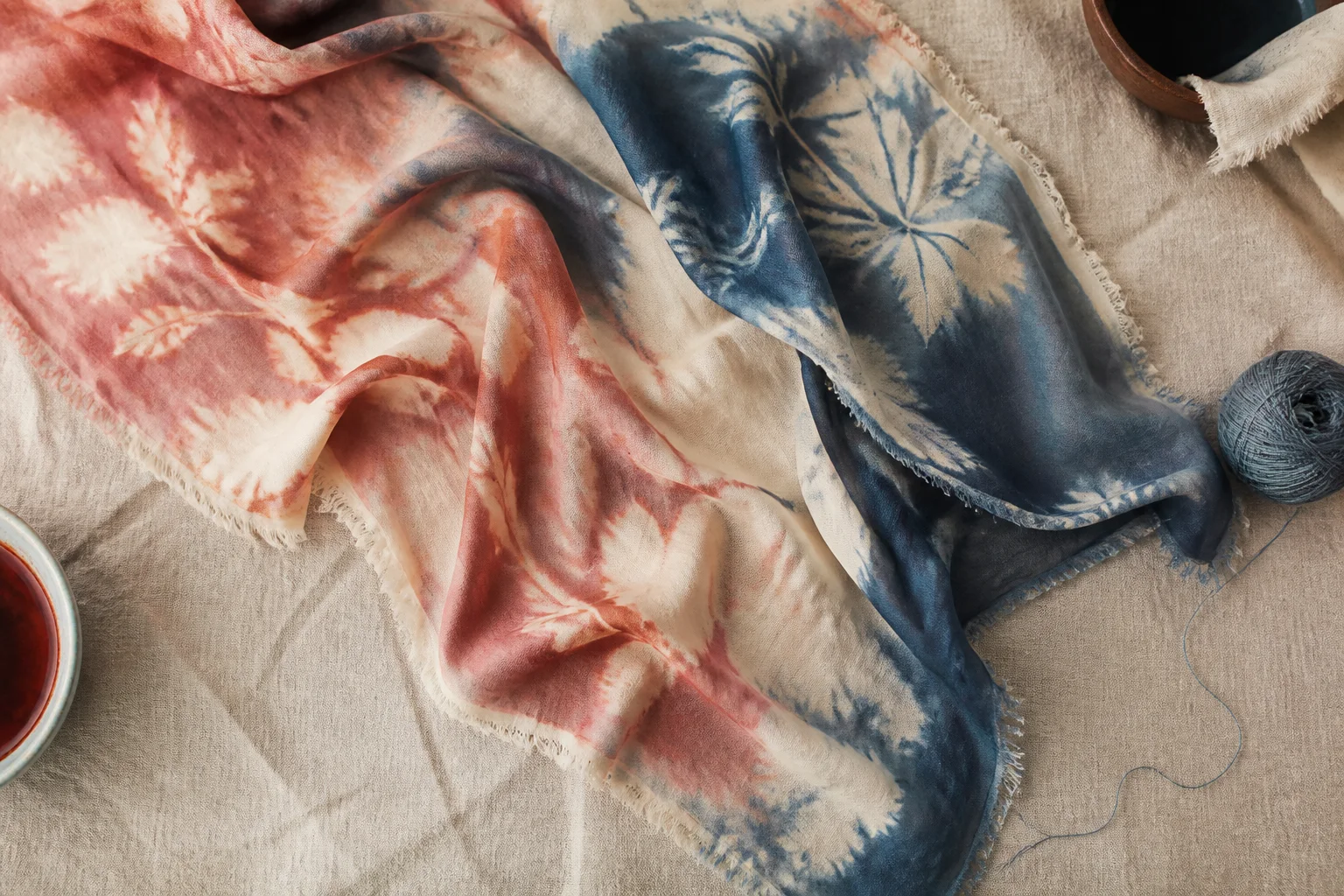 Silk scarf with soft floral-like resist motifs on linen